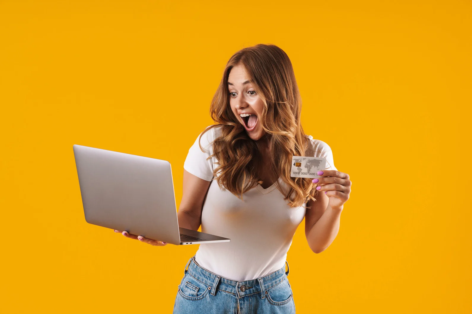 Woman Holding Laptop and Credit Card